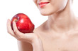 Portrait of smiling woman holding red apple isolated on white