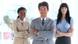 Smiling business people crossing their arms