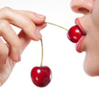 Young woman with cherry isolated on white