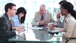 Smiling businessman talking with his team