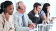 Cheerful business team using headsets
