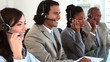 Happy call centre agents wearing headsets