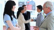 Smiling business team talking together