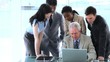 Businesswoman pointing at a laptop