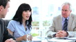 Happy work team talking together