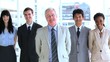 Smiling employees standing upright together