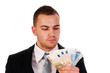 business man looking at the money in his hands business man looking at the money in his hands