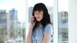 Cheerful businesswoman talking on the phone
