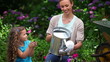 Video: Mother and daughter watering plants Mother and daughter watering plants