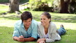 Smiling parents chatting and then their children are coming