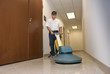 Cleaning floors with a buffing machine