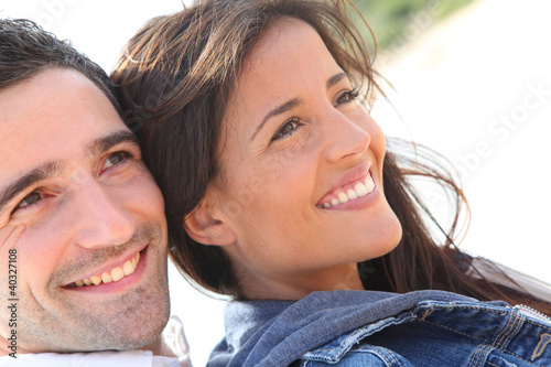 Photo: Portrait of happy young couple Portrait of happy young couple