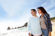 Romantic couple walking by the beach
