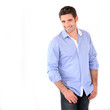 Handsome man standing on white background