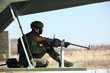 Soldier in helicopter on patrol