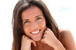 Portrait of attractive brunette laying on a beach