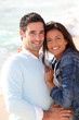 Romantic couple walking by the beach