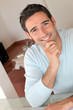 Portrait of smiling man working from home Portrait of smiling man working from home