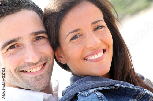 Photo: Portrait of happy young couple Portrait of happy young couple