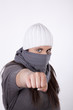 Young masked woman with closed fist