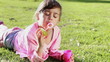 Happy girl making bubbles with a bubble wand