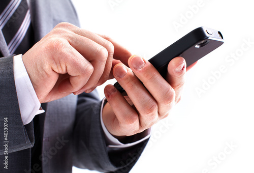 Photo: Businessman calling by phone. Businessman calling by phone.