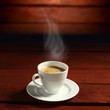 coffee on dark, red, wooden background