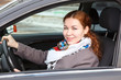 Pretty young Caucasian woman driving a car Pretty young Caucasian woman driving a car