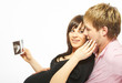 young couple with ultrasound picture of their unborn child