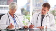 Video: Medical team writing on their notebooks Medical team writing on their notebooks