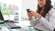 Video: Businesswoman writing a text message Businesswoman writing a text message