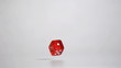 Red dice bouncing in super slow motion
