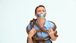 Woman with tape on the mouth and attached with a rope