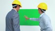 Architects talking in front of a blank space on the wall