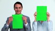 Business people hiding their face with a sign