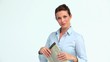 Well-dressed woman reads the news and looks at camera