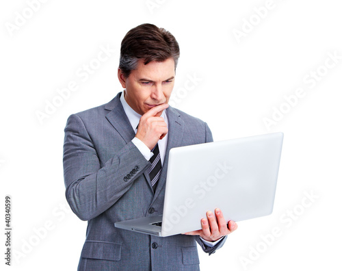 Photo: Executive businessman with laptop. Executive businessman with laptop.
