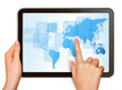 Finger touching world map on a touch screen