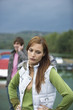 Young woman annoyed with boyfriend using mobile phone