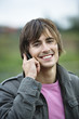 Young man using mobile phone, portrait