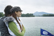 Young couple smiling by river