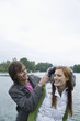 Young couple enjoying in front of river