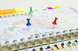 Planning business trip with pushpins Planning business trip with pushpins