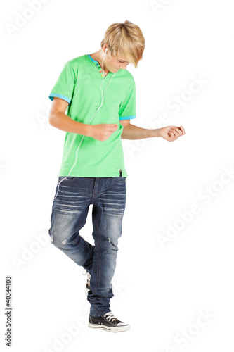 Photo: teen boy dancing with music isolated on white teen boy dancing with music isolated on white