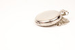 Photo: Closed pocket watch isolated on white Closed pocket watch isolated on white