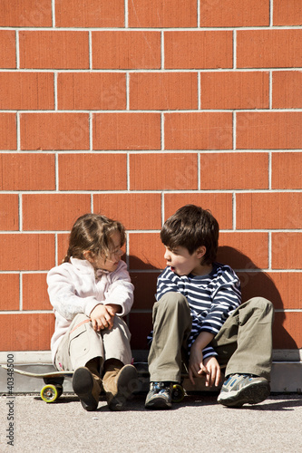 Photo: sister and brother discuss sister and brother discuss