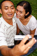 ethnic couple taking self portrait ethnic couple taking self portrait