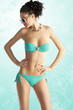 Photo: girl in beach wear with sunglasses, she looks down at right girl in beach wear with sunglasses, she looks down at right