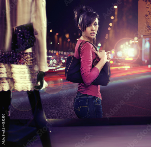 Photo: Walking woman looking at shop window Walking woman looking at shop window