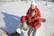 Photo: Young couple enjoying on snow, portrait Young couple enjoying on snow, portrait